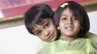 young indian boy and girl smiling